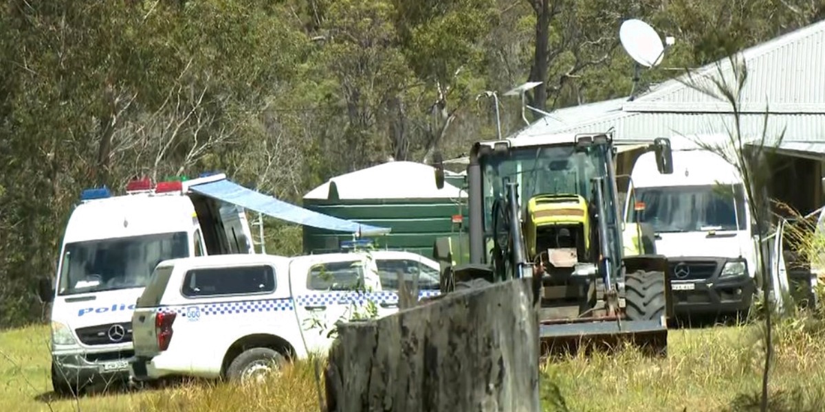 Neighbour charged after father and son found dead 15 days apart at Gurranang